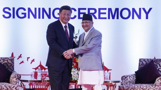 Chinese President Xi Jinping, left, and Nepalese Prime Minister Khadga Prasad Oli greet during their bilateral meeting in Kathmandu, Nepal in October 2019.(AP File Photo)