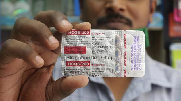 A chemist holds a pack of hydroxychloroquine tablets in Mumbai. A report in the journal Lancet shows malaria drugs pushed by U.S. President Donald Trump as treatments for the coronavirus not only did not help but were tied to a greater risk of death and heart rhythm problems. (AP File) A chemist holds a pack of hydroxychloroquine tablets in Mumbai. A report in the journal Lancet shows malaria drugs pushed by U.S. President Donald Trump as treatments for the coronavirus not only did not help but were tied to a greater risk of death and heart rhythm problems. (AP File)