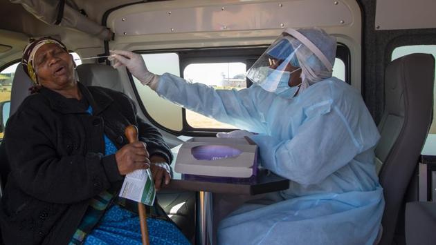 An elderly woman reacts as a heath worker collects a sample for coronavirus testing in Katlehong, South Africa on May 22. A worrying development is the number of infected health workers in a part of the world where staffing is largely threadbare— more than 3,400 as reported by AP. Some workers have threatened to strike over insufficient protective gear. (Themba Hadebe / AP) An elderly woman reacts as a heath worker collects a sample for coronavirus testing in Katlehong, South Africa on May 22. A worrying development is the number of infected health workers in a part of the world where staffing is largely threadbare— more than 3,400 as reported by AP. Some workers have threatened to strike over insufficient protective gear. (Themba Hadebe / AP)