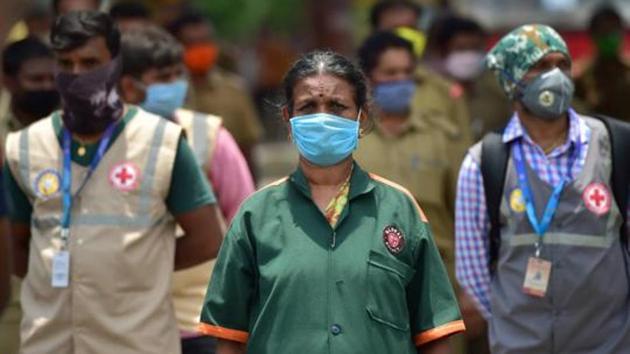 COVID-19 frontline workers wait for the arrival of Karnataka Deputy Chief Minister Laxman Savadi (unssen), during an event to pay tribute to the contribution of the workers in India's fight against coronavirus, in Bengaluru, Wednesday, May 6, 2020. (PTI) COVID-19 frontline workers wait for the arrival of Karnataka Deputy Chief Minister Laxman Savadi (unssen), during an event to pay tribute to the contribution of the workers in India's fight against coronavirus, in Bengaluru, Wednesday, May 6, 2020. (PTI)