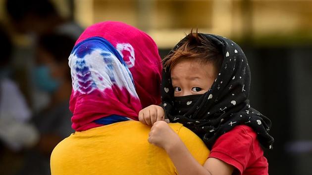 A migrant family from Manipur waits to get a medical certificate to go to their hometown, at a camp in Chennai on May 19. (PTI Photo) A migrant family from Manipur waits to get a medical certificate to go to their hometown, at a camp in Chennai on May 19. (PTI Photo)