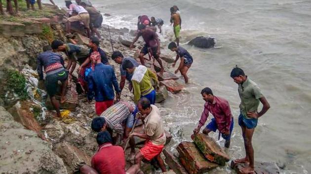 A visit to the cyclone-hit areas of the Sunderbans region in the districts of North 24-Parganas and South 24-Parganas revealed that area after area was inundated, with crops on the field ruined and fishes in the ponds dead.(PTI PHOTO.)