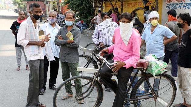 Daily wage labourers gathered at a city crossing in search of employment after relaxation in lockdown norms in the fourth phase, in Lucknow on Thursday. (ANI Photo) Daily wage labourers gathered at a city crossing in search of employment after relaxation in lockdown norms in the fourth phase, in Lucknow on Thursday. (ANI Photo)