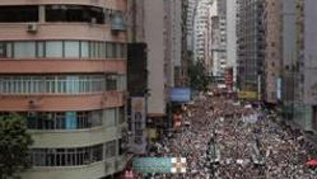 As Wang addressed his annual press conference in Beijing, protests gripped Hong Kong on Sunda (AP) As Wang addressed his annual press conference in Beijing, protests gripped Hong Kong on Sunda (AP)
