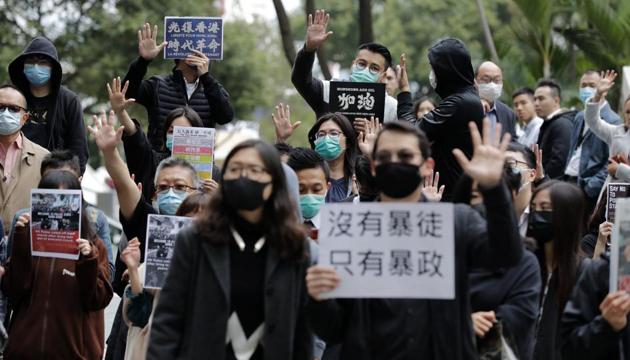 Protesters hold up their hands to represent their five demands during a rally in Hong Kong Thursday, Jan. 2, 2020.(AP)