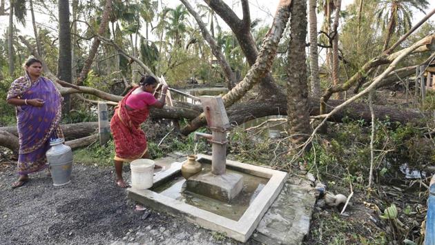 Women fill water from a handpump after their local pond was filled with saline water that has killed fresh water fish and was brought upstream due to the cyclone. Chief Minister Mamata Banerjee told the Prime Minister Narendra Modi on his visit to the state that the cyclone had, according to the government’s back of the envelope calculations, caused destruction worth Rs. 1 lakh crore. (Samir Jana / HT Photo) Women fill water from a handpump after their local pond was filled with saline water that has killed fresh water fish and was brought upstream due to the cyclone. Chief Minister Mamata Banerjee told the Prime Minister Narendra Modi on his visit to the state that the cyclone had, according to the government’s back of the envelope calculations, caused destruction worth Rs. 1 lakh crore. (Samir Jana / HT Photo)