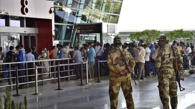 CISF security personnel at T3 Indira Gandhi International (IGI) Airport, in New Delhi on Sunday. The flight services are resuming from Monday after an order by the central government.(Ajay Aggarwal /HT PHOTO)