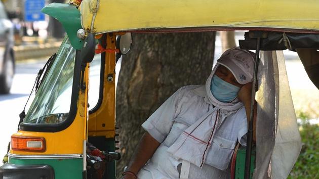 An auto-rickshaw driver takes a cat nap with his face covered while waiting for passengers at KG Marg, New Delhi, on May 24. According to Kuldeep Shrivastava, head of the regional weather forecasting centre, from May 28, dust storms and thunderstorms are expected due to a western disturbance as wind speed will increase to 50 to 60 kmph and there will also be clouding, reported HT. (Mohd Zakir / HT Photo) An auto-rickshaw driver takes a cat nap with his face covered while waiting for passengers at KG Marg, New Delhi, on May 24. According to Kuldeep Shrivastava, head of the regional weather forecasting centre, from May 28, dust storms and thunderstorms are expected due to a western disturbance as wind speed will increase to 50 to 60 kmph and there will also be clouding, reported HT. (Mohd Zakir / HT Photo)