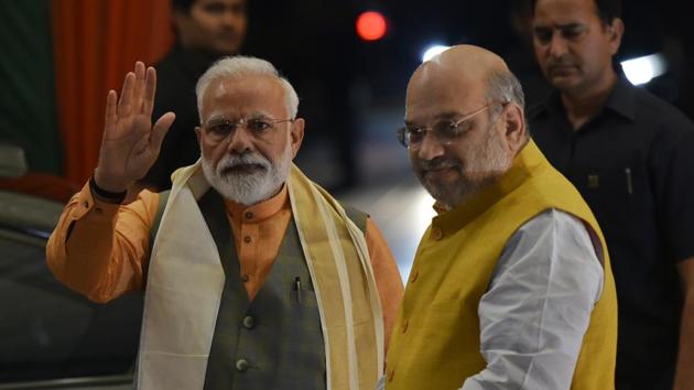 Prime Minister Narendra Modi seen with Amit Shah at BJP headquarters, in New Delhi.(Photo by Vipin Kumar / Hindustan Times)