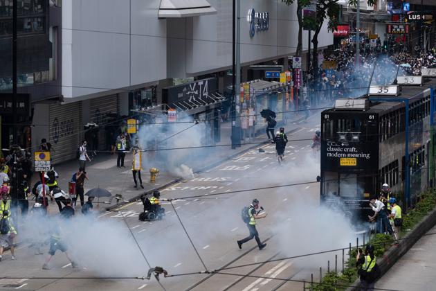 In a return of the unrest that roiled Hong Kong last year, crowds thronged the streets of the city on Sunday in defiance of curbs imposed to contain the coronavirus.(Bloomberg)