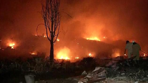 Firefighters trying to control the blaze in Tughlakabad on Tuesday.(ANI photo)
