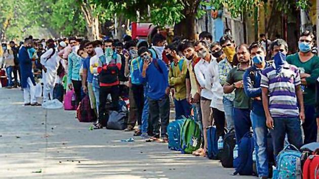 People wait outside CSMT to board a special train in Mumbai on Monday. (Bhushan Koyande/HT photo) People wait outside CSMT to board a special train in Mumbai on Monday. (Bhushan Koyande/HT photo)