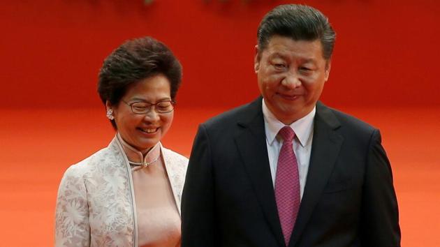 Hong Kong Chief Executive Carrie Lam and Chinese President Xi Jinping walk after Lam took her oath, during the 20th anniversary of the city's handover from British to Chinese rule, in Hong Kong. (REUTERS) Hong Kong Chief Executive Carrie Lam and Chinese President Xi Jinping walk after Lam took her oath, during the 20th anniversary of the city's handover from British to Chinese rule, in Hong Kong. (REUTERS)