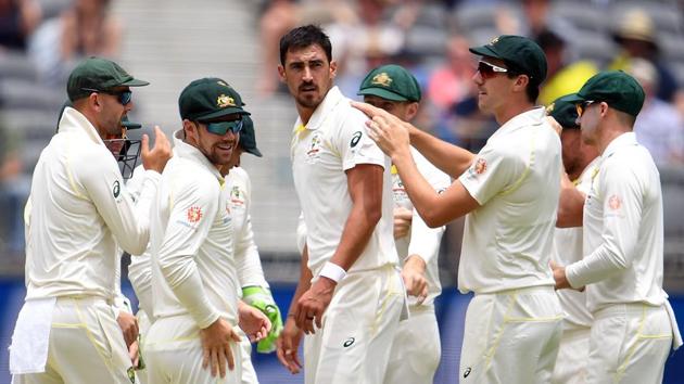 Australia's Mitchell Starc (C) celebrates with teammates the dismissal of India's batsman Murali Vijay(AFP)