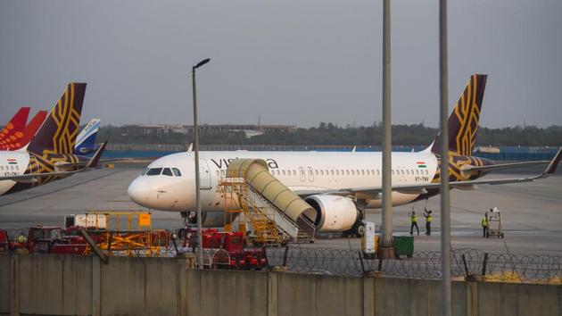 Workers cleaning a plane at Indira Gandhi International (IGI) Airport, in New Delhi on Sunday, May 24, 2020. (Amal KS/HT PHOTO) Workers cleaning a plane at Indira Gandhi International (IGI) Airport, in New Delhi on Sunday, May 24, 2020. (Amal KS/HT PHOTO)
