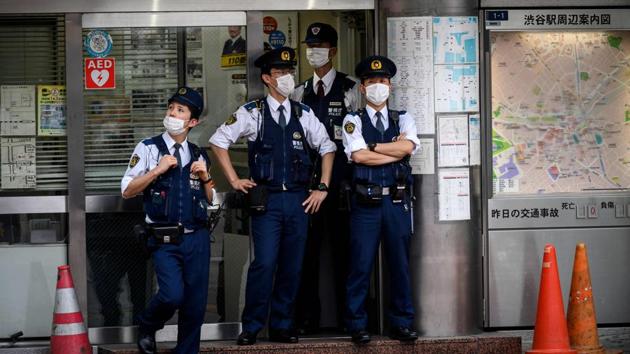 Japanese police officers wearing face masks stand in front of a police station in the Shibuya district of Tokyo on May 26. The Tokyo region -- the worst-hit by the virus -- was the largest site of infection. Tokyo Governor Yuriko Koike has warned against complacency and said everyone had to get used to a “new normal”, Reuters reported. (Behrouz Mehri / AFP) Japanese police officers wearing face masks stand in front of a police station in the Shibuya district of Tokyo on May 26. The Tokyo region -- the worst-hit by the virus -- was the largest site of infection. Tokyo Governor Yuriko Koike has warned against complacency and said everyone had to get used to a “new normal”, Reuters reported. (Behrouz Mehri / AFP)