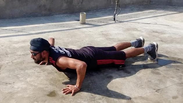 Visually impaired sprinter Gurveer Singh Dehlon working out at home during lockdown in Ludhiana on Monday. (HT PHOTO) Visually impaired sprinter Gurveer Singh Dehlon working out at home during lockdown in Ludhiana on Monday. (HT PHOTO)