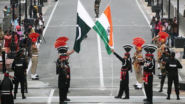 Pakistani Rangers (wearing black uniforms) and Indian Border Security Force (BSF) officers lower their national flags during parade on the Pakistan's 72nd Independence Day, at the Pakistan-India joint check-post at Wagah border, near Lahore, Pakistan. (REUTERS/ File photo) Pakistani Rangers (wearing black uniforms) and Indian Border Security Force (BSF) officers lower their national flags during parade on the Pakistan's 72nd Independence Day, at the Pakistan-India joint check-post at Wagah border, near Lahore, Pakistan. (REUTERS/ File photo)