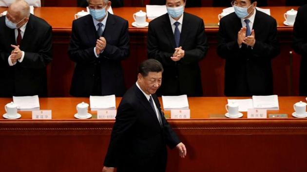 Chinese President Xi Jinping walks past officials wearing face masks following the coronavirus disease (COVID-19) outbreak as he arrives for the opening session of the National People's Congress (NPC) at the Great Hall of the People in Beijing, China.(REUTERS)