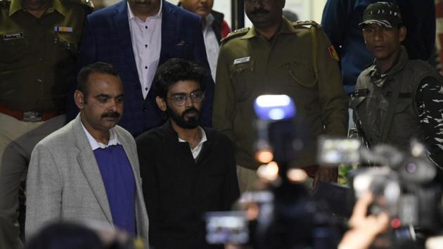 JNU student Sharjeel Imam is seen with Crime branch officials after he was arrested from Bihar, at Saket Police station, in New Delhi, on January 29, 2020. (Photo by Biplov Bhuyan / Hindustan Times) JNU student Sharjeel Imam is seen with Crime branch officials after he was arrested from Bihar, at Saket Police station, in New Delhi, on January 29, 2020. (Photo by Biplov Bhuyan / Hindustan Times)