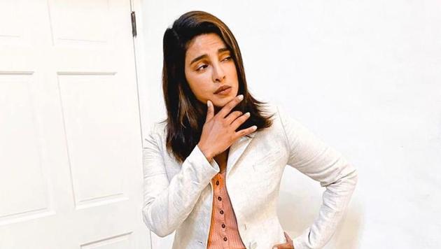 Priyanka personified ‘Work From Home’ to perfection as she paired loose pajamas and slides with her smart and stylish off-white blazer and pale pink top, letting her inner lazy girl shine.(Instagram)