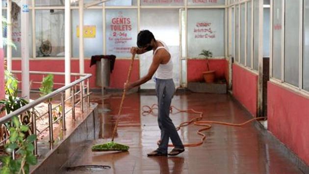 A worker cleans toilets at Jubilee Bus Station (JBS) as Telangana State Road Transport Corporation (TSRTC) resumed bus services after the government eased a nationwide lockdown imposed as a preventive measure against the COVID-19 coronavirus in Secunderabad on May 19, 2020/ representative.(AFP) A worker cleans toilets at Jubilee Bus Station (JBS) as Telangana State Road Transport Corporation (TSRTC) resumed bus services after the government eased a nationwide lockdown imposed as a preventive measure against the COVID-19 coronavirus in Secunderabad on May 19, 2020/ representative.(AFP)