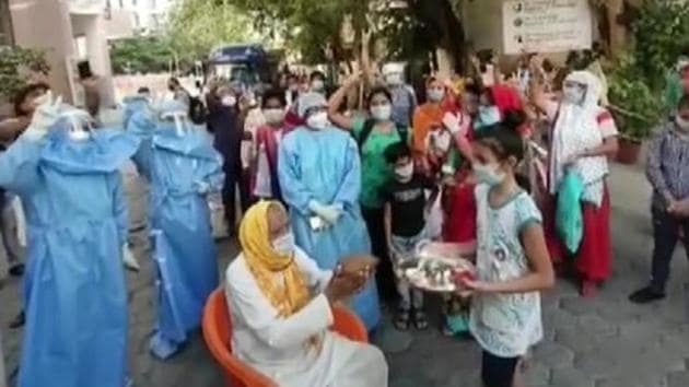 Hospital staff showered flowers on the 90-year-old man, Rameshwar Chaudhary, when he was discharged from the hospital.(ANI)