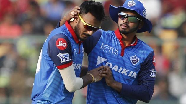 Delhi Capitals' Axar Patel, left, celebrates with captain Shreyas Iyer the dismissal of Royal Challengers Bangalore's Marcus Stoinis during the VIVO IPL T20 cricket match.(AP)