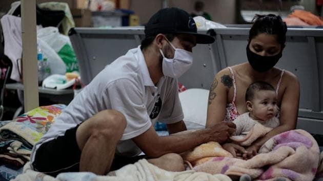 The group are living in three separate areas in clear violation of social distancing, with many children among families. Sao Paulo is also the epicentre of Covid-19 in Brazil, which is by far the hardest hit country in Latin America. Sao Paulo state alone has reported 89,000 cases and 6,700 deaths. By contrast, all of Colombia has around 24,000 cases and 800 deaths as of May 29. (Miguel Schincariol / AFP) The group are living in three separate areas in clear violation of social distancing, with many children among families. Sao Paulo is also the epicentre of Covid-19 in Brazil, which is by far the hardest hit country in Latin America. Sao Paulo state alone has reported 89,000 cases and 6,700 deaths. By contrast, all of Colombia has around 24,000 cases and 800 deaths as of May 29. (Miguel Schincariol / AFP)