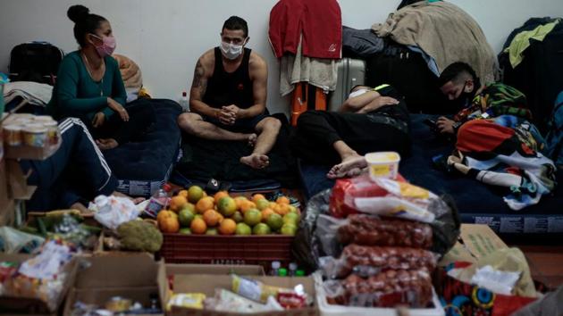 Food has been reaching the Colombian nationals by way of donations. Considering the risk of being in a non-controlled environment like an airport, the Colombian embassy said a transfer to a municipal hostel had been offered but was declined by their fellow citizens. (Miguel Schincariol / AFP) Food has been reaching the Colombian nationals by way of donations. Considering the risk of being in a non-controlled environment like an airport, the Colombian embassy said a transfer to a municipal hostel had been offered but was declined by their fellow citizens. (Miguel Schincariol / AFP)