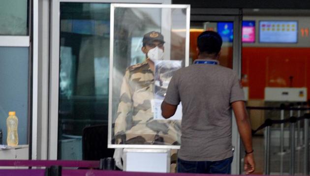 A security man checks the ID of staff before entering the Kempe Gowda International Airport following the resumption of domestic airline services from tomorrow, in Bengaluru on Sunday.(ANI file photo) A security man checks the ID of staff before entering the Kempe Gowda International Airport following the resumption of domestic airline services from tomorrow, in Bengaluru on Sunday.(ANI file photo)