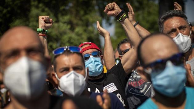 Nissan workers react during a protest against the loss of some 3,000 direct jobs outside their factory in Barcelona. Workers’ unions have warned 20,000 more jobs in Nissan’s supply chain in Spain are also at risk if Nissan closes its factory in Barcelona and two smaller ones in nearby towns, AP reported. (Emilio Morenatti / AP) Nissan workers react during a protest against the loss of some 3,000 direct jobs outside their factory in Barcelona. Workers’ unions have warned 20,000 more jobs in Nissan’s supply chain in Spain are also at risk if Nissan closes its factory in Barcelona and two smaller ones in nearby towns, AP reported. (Emilio Morenatti / AP)