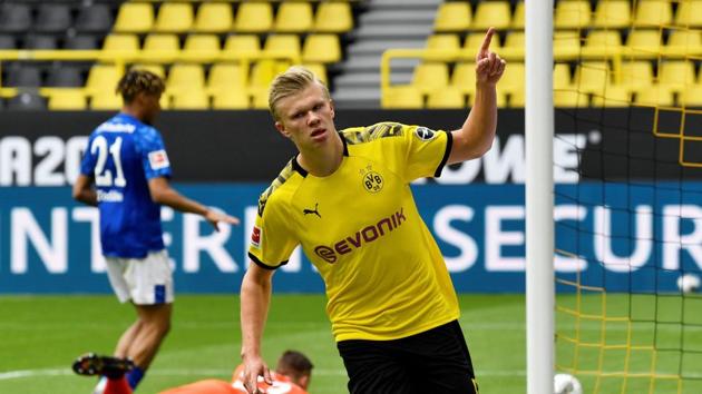 Dortmund's Erling Braut Haaland celebrates scoring their first goal as play resumes behind closed doors following the outbreak of the coronavirus disease (COVID-19)(REUTERS)