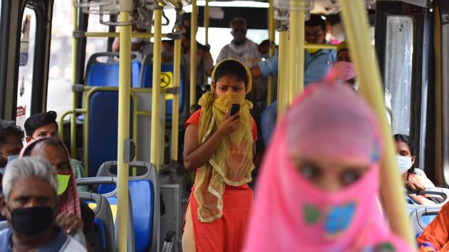 A view inside a DTC bus with people seated while observing social distancing in New Delhi on Thursday.(Raj K Raj/HT Photo)