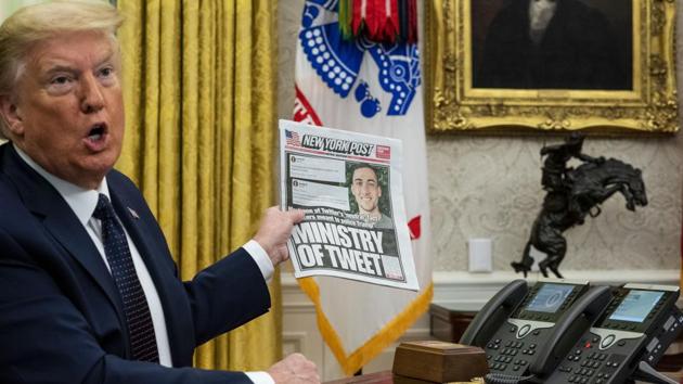 US President Donald Trump speaks while holding up a copy of the New York Post newspaper before signing an executive order in Washington, SC, US. Trump called out a single Twitter employee Thursday in a tweet complaining that the platform's decision to fact check his tweets on mail balloting could "taint" the election.(Bloomberg) US President Donald Trump speaks while holding up a copy of the New York Post newspaper before signing an executive order in Washington, SC, US. Trump called out a single Twitter employee Thursday in a tweet complaining that the platform's decision to fact check his tweets on mail balloting could "taint" the election.(Bloomberg)