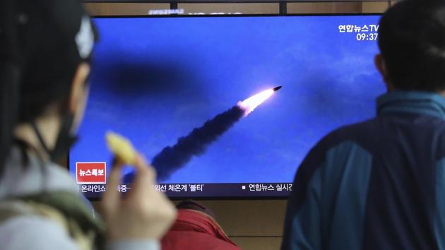 People watch a television screen showing a file image of North Korea's missile launch during a news program at the Seoul Railway Station in Seoul, South Korea. (AP)