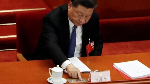 Chinese President Xi Jinping casts his vote on the national security legislation for Hong Kong Special Administrative Region at the closing session of the National People's Congress (NPC) at the Great Hall of the People in Beijing, China. (REUTERS) Chinese President Xi Jinping casts his vote on the national security legislation for Hong Kong Special Administrative Region at the closing session of the National People's Congress (NPC) at the Great Hall of the People in Beijing, China. (REUTERS)