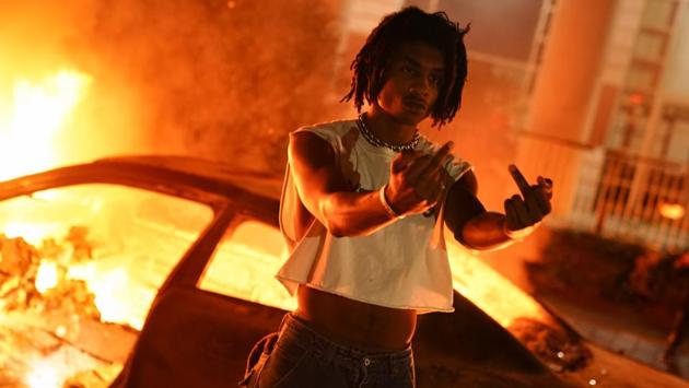 A man poses in front of a burning car during a protest on May 29 in Atlanta, Georgia. Demonstrations are being held across the US after George Floyd died in police custody on May 25 in Minneapolis, Minnesota. (Elijah Nouvelage / Getty Images / AFP) A man poses in front of a burning car during a protest on May 29 in Atlanta, Georgia. Demonstrations are being held across the US after George Floyd died in police custody on May 25 in Minneapolis, Minnesota. (Elijah Nouvelage / Getty Images / AFP)