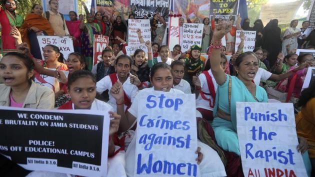 Indian women and girls hold placards during a protest against sexual violence against women in Ahmadabad.(HT Archive)