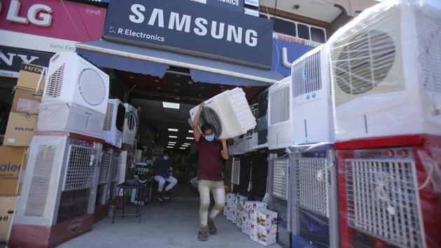 A worker carries an air cooler from a shop in Jammu on May 26. Only around seven percent of Indian households have air conditioning, reported AFP, despite rising incomes making the luxury more affordable for some. (Channi Anand / AP) A worker carries an air cooler from a shop in Jammu on May 26. Only around seven percent of Indian households have air conditioning, reported AFP, despite rising incomes making the luxury more affordable for some. (Channi Anand / AP)