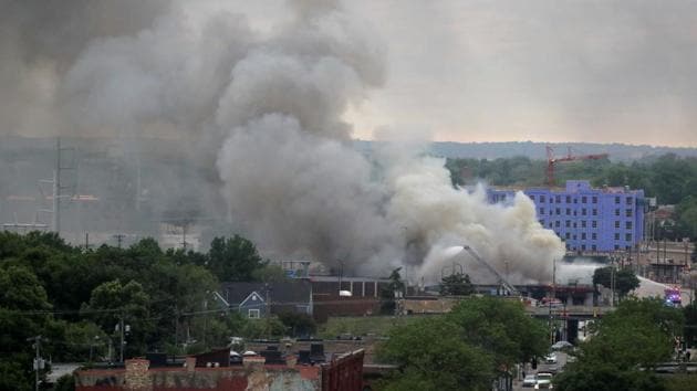 Plumes of smoke rise into the sky in the aftermath of a protest after a white police officer was caught on a bystander's video pressing his knee into the neck of African-American man George Floyd, who later died at a hospital in Minneapolis, Minnesota on May 29. (Carlos Barria / REUTERS) Plumes of smoke rise into the sky in the aftermath of a protest after a white police officer was caught on a bystander's video pressing his knee into the neck of African-American man George Floyd, who later died at a hospital in Minneapolis, Minnesota on May 29. (Carlos Barria / REUTERS)