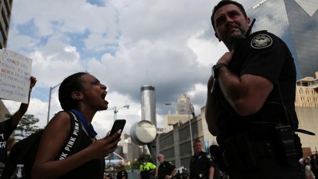 A woman yells at a cop during a protest against the death in Minneapolis police custody of African-American man George Floyd, in Atlanta, Georgia on May 29. (Dustin Chambers / REUTERS) A woman yells at a cop during a protest against the death in Minneapolis police custody of African-American man George Floyd, in Atlanta, Georgia on May 29. (Dustin Chambers / REUTERS)