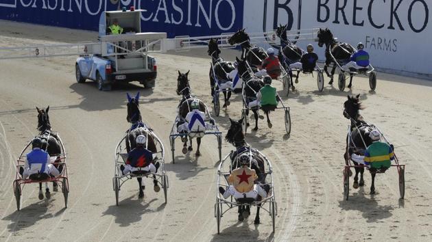 A scene from the harness racing event at the Addington Raceway. New Zealand’s decision to go into lockdown quickly to curb the spread of the coronavirus has been largely successful and restrictions are gradually being eased. A total of 22 people have died of COVID-19 and 1,504 have been infected due to the virus in New Zealand so far. (Mark Baker / AP)