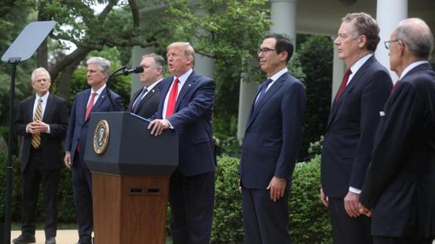 US President Donald Trump stands with members of his Cabinet as he makes an announcement about US trade relations with China and Hong Kong in the Rose Garden of the White House in Washington, US. (REUTERS) US President Donald Trump stands with members of his Cabinet as he makes an announcement about US trade relations with China and Hong Kong in the Rose Garden of the White House in Washington, US. (REUTERS)