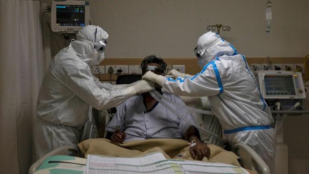 Medical workers attend to a patient at Max Smart Super Speciality Hospital. The hotels that have been fully taken over are Hotel Crown Plaza in Okhla Phase 1 (attached to Batra hospital research centre), Hotel Sheraton in Saket (Max Smart Super Specialty hospital), Hotel Surya in New Friends Colony (Indraprastha Apollo hospital), Hotel Siddharth in Rajendra Place (Dr. BL Kapur Memorial hospital) and Hotel Jivitesh at Pusa Road (Sir Ganga Ram hospital). (Danish Siddiqui / REUTERS)