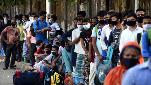 People standing in a queue outside CSMT to board special trains to return to their native places outside Maharashtra during the ongoing nationwide lockdown in Mumbai.(HT PHOTO.) People standing in a queue outside CSMT to board special trains to return to their native places outside Maharashtra during the ongoing nationwide lockdown in Mumbai.(HT PHOTO.)