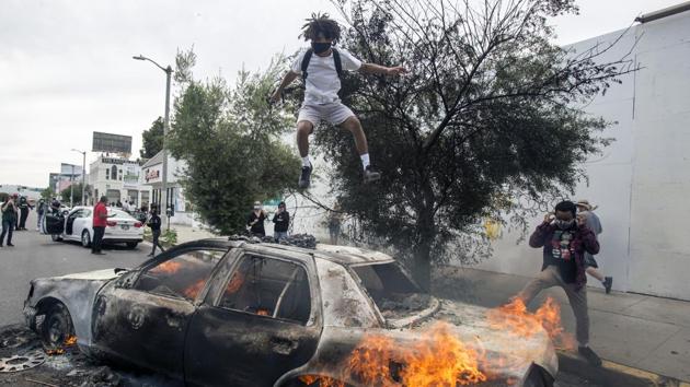 Hundreds of people were arrested Friday, and police used batons, rubber bullets and pepper spray to push back crowds in some cities.(AP) Hundreds of people were arrested Friday, and police used batons, rubber bullets and pepper spray to push back crowds in some cities.(AP)