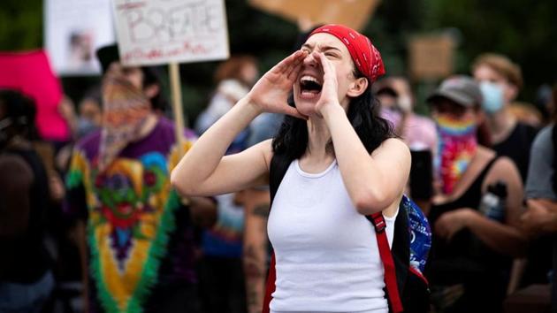 A protester yells during a rally against the death in Minneapolis police custody of George Floyd, in Denver, Colorado, US.(Reuters) A protester yells during a rally against the death in Minneapolis police custody of George Floyd, in Denver, Colorado, US.(Reuters)