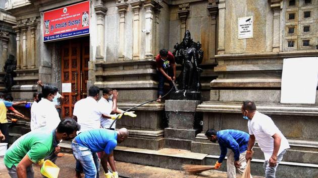 Bengaluru: Congress MLA Sowmya Reddy along with others cleans a temple premises after the authorities permitted to open religious places from June 1, during the ongoing COVID-19 lockdown, in Bengaluru. (PTI) Bengaluru: Congress MLA Sowmya Reddy along with others cleans a temple premises after the authorities permitted to open religious places from June 1, during the ongoing COVID-19 lockdown, in Bengaluru. (PTI)
