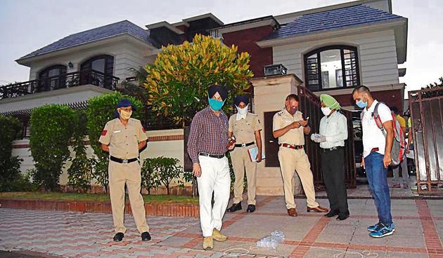 Police officials at the spot in Sector 33-C, Chandigarh on Sunday. The masked shooters were caught in the CCTV footage. (Keshav Singh/HT) Police officials at the spot in Sector 33-C, Chandigarh on Sunday. The masked shooters were caught in the CCTV footage. (Keshav Singh/HT)